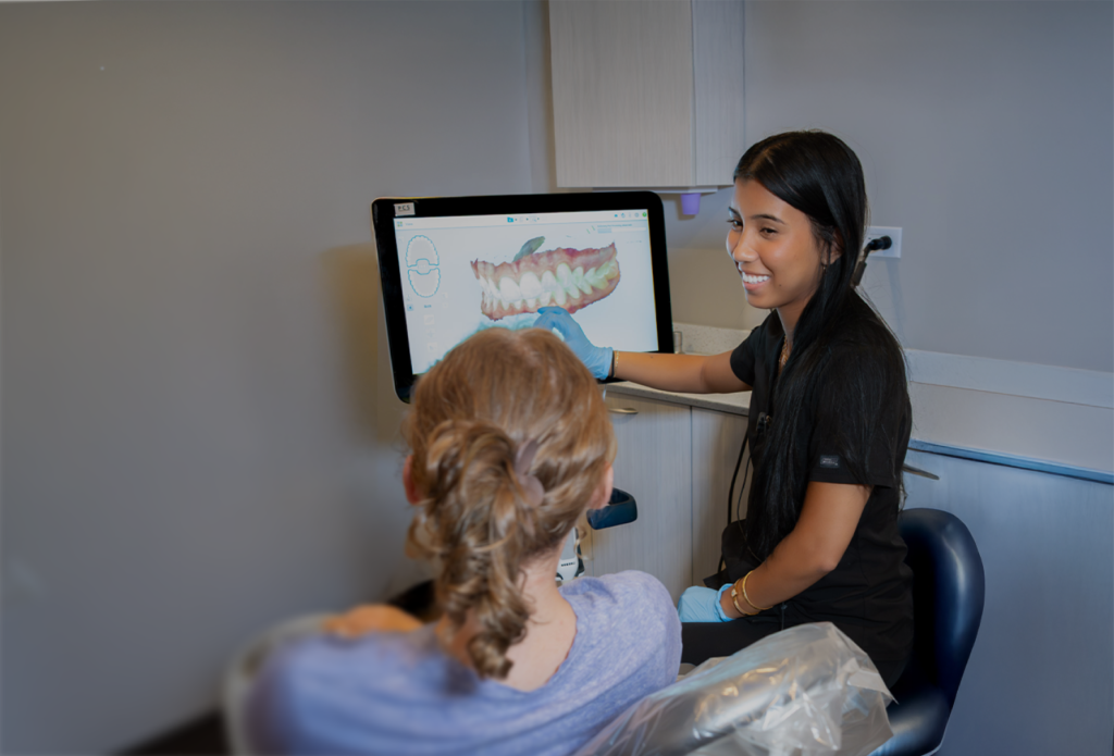 Dentist showing 3D teeth scan